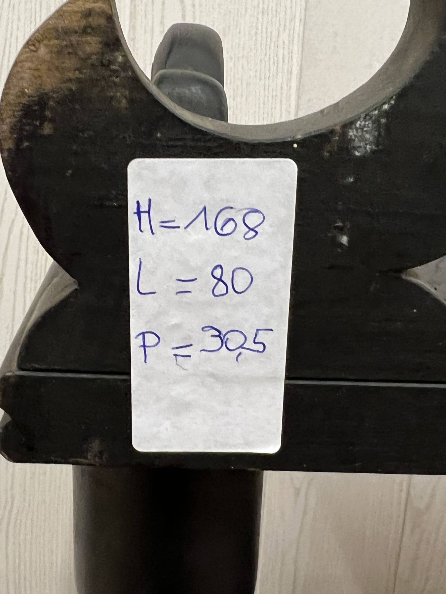 Blackened wooden shelf.