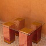 Modern coffee table in burgundy zellige with a tempered glass top.