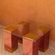 Modern coffee table in burgundy zellige with a tempered glass top.