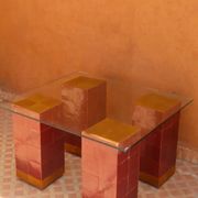 Modern coffee table in burgundy zellige with a tempered glass top.
