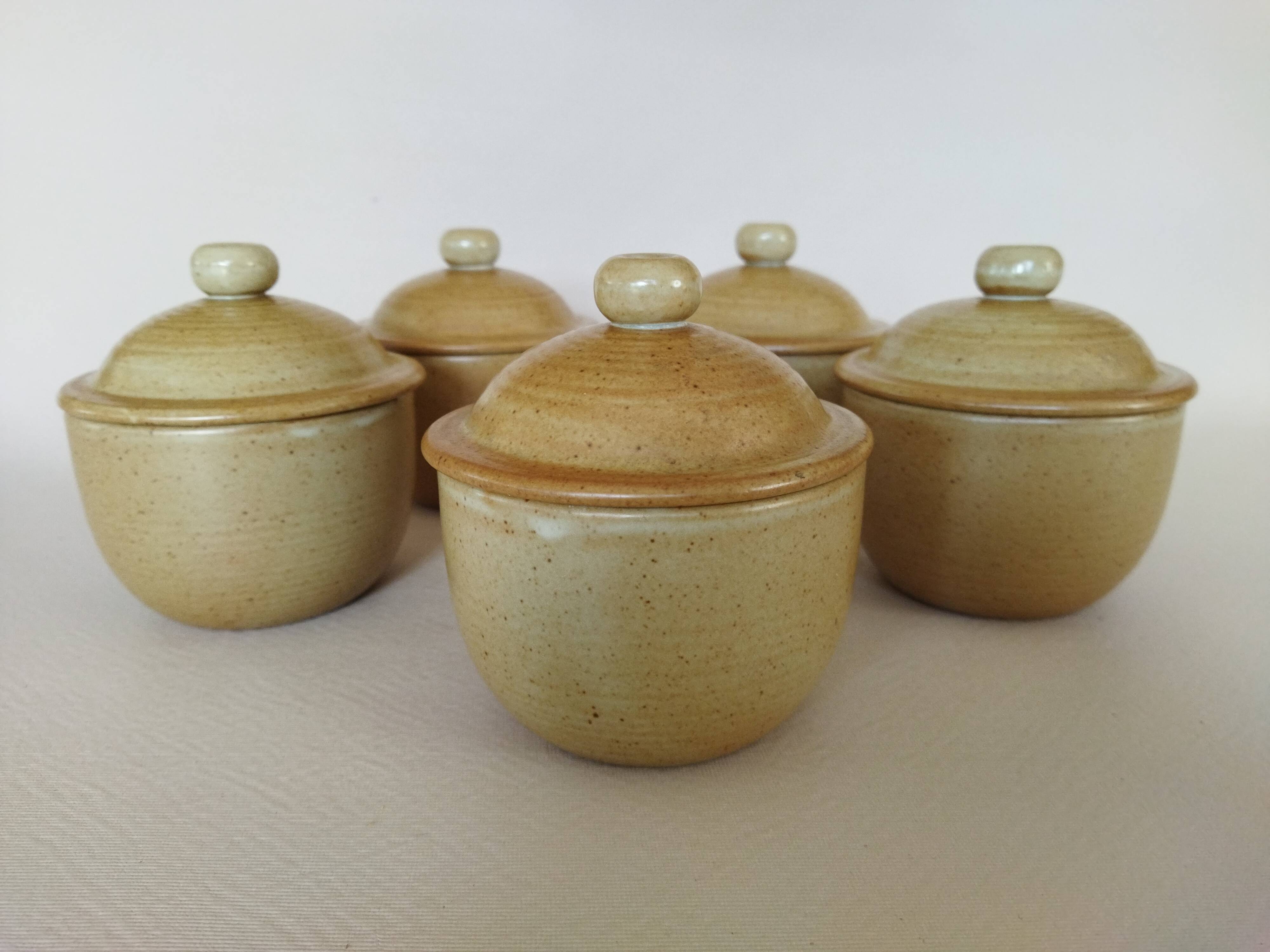 Covered tea bowls in CNP Village sandstone