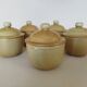 Covered tea bowls in CNP Village sandstone