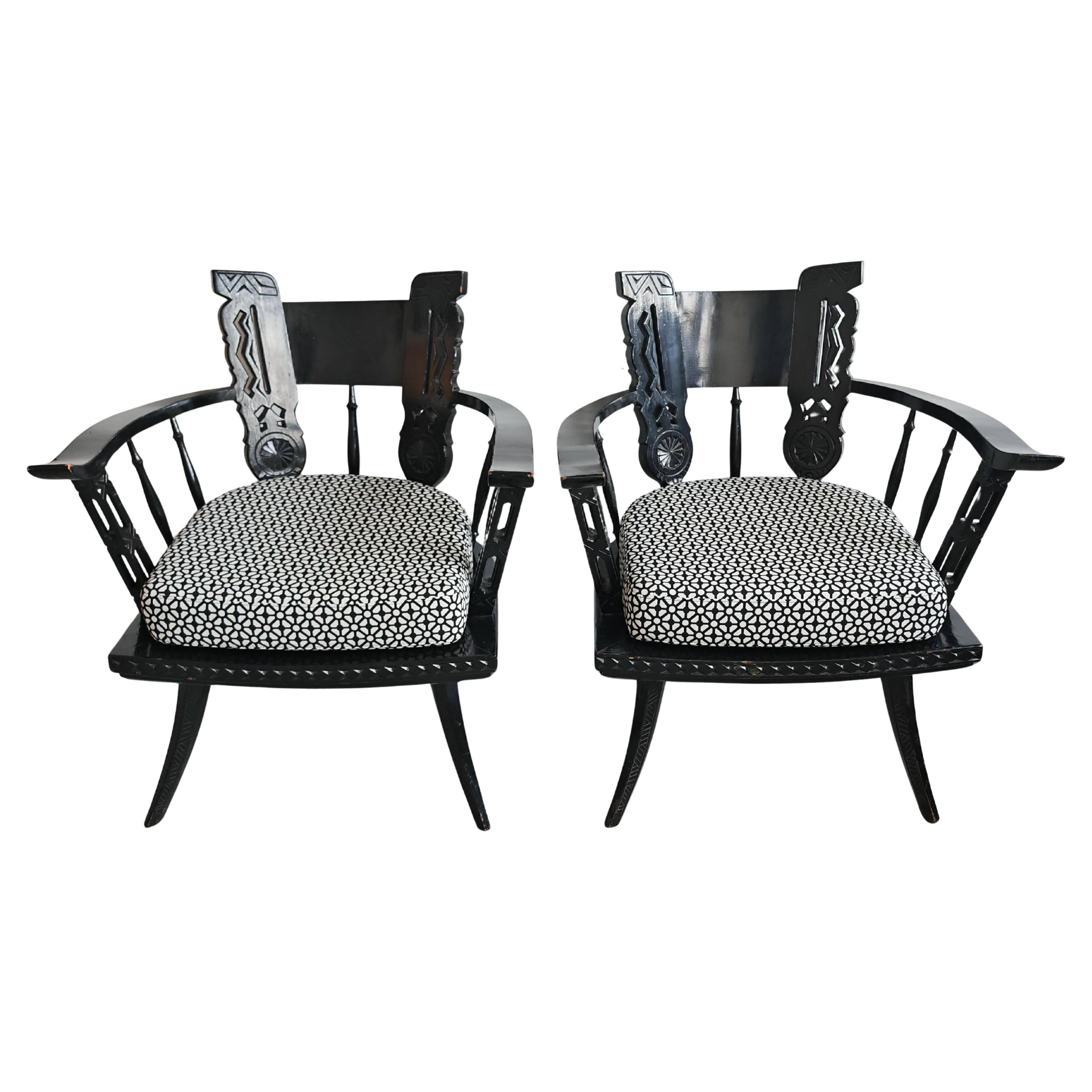 Pair of antique hand-carved armchairs in black lacquer from the 1920s.