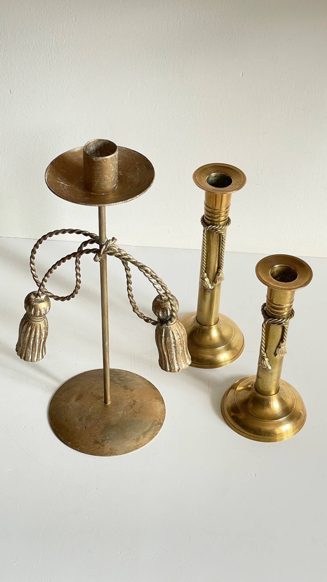 Trio of vintage knotted candlesticks brass