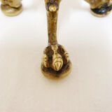 Golden candle holder with lion's head and legs