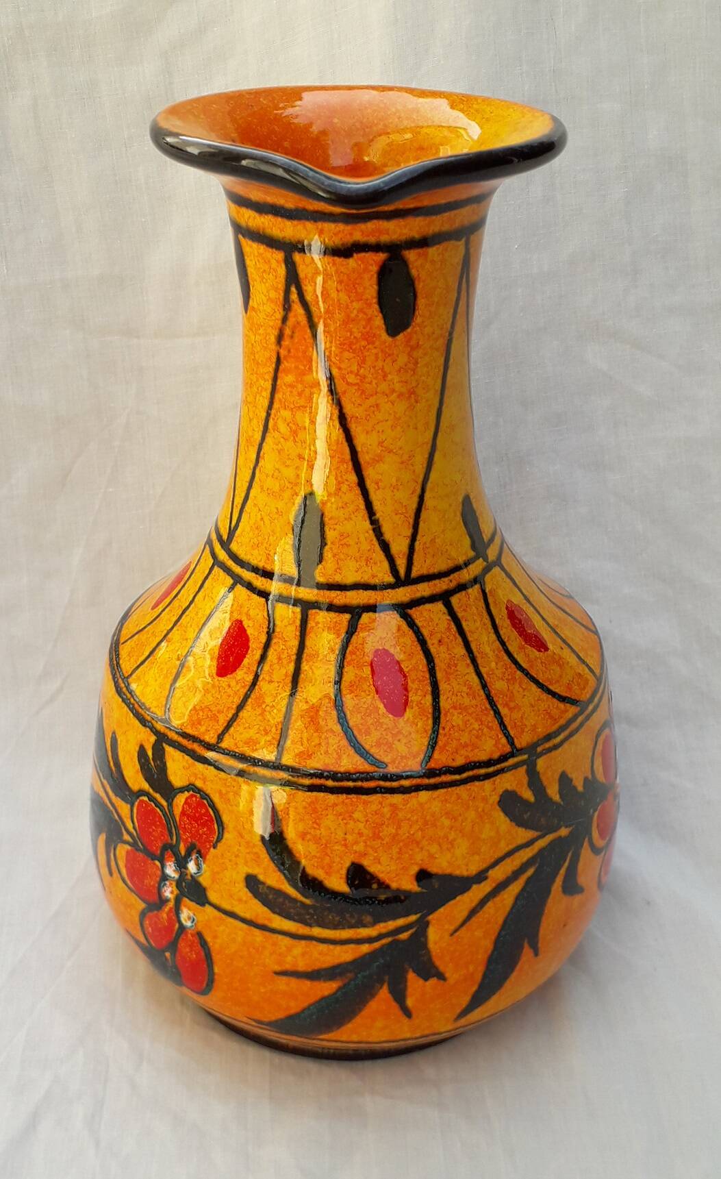 Orange ceramic jug