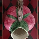 Pink pitcher in the shape of a strawberry, Italian slurry.