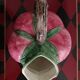 Pink pitcher in the shape of a strawberry, Italian slurry.