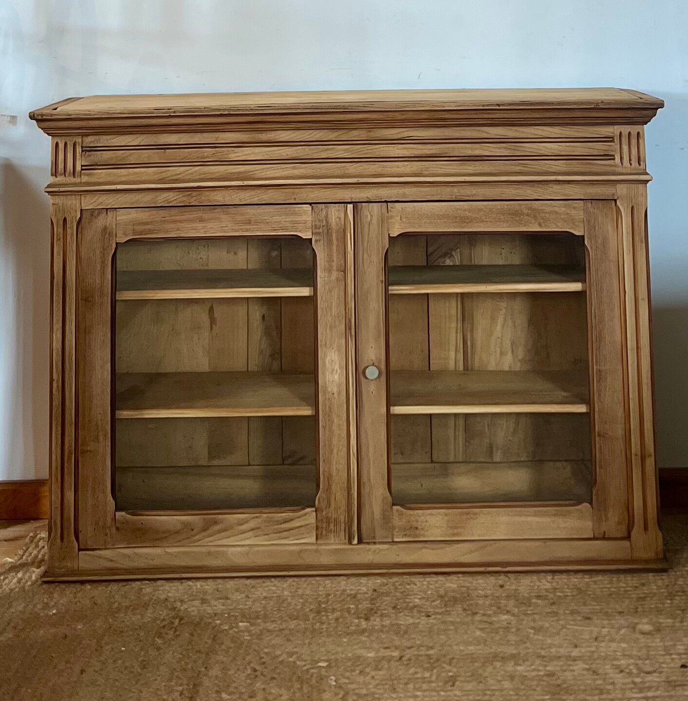 Old glass-fronted Parisian buffet in raw solid wood