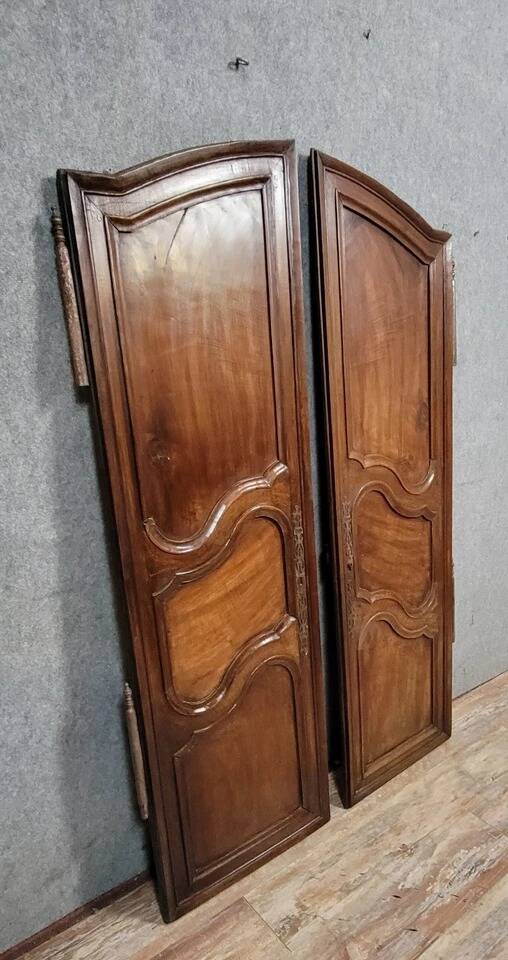Pair of Louis XV period molded doors in solid walnut
