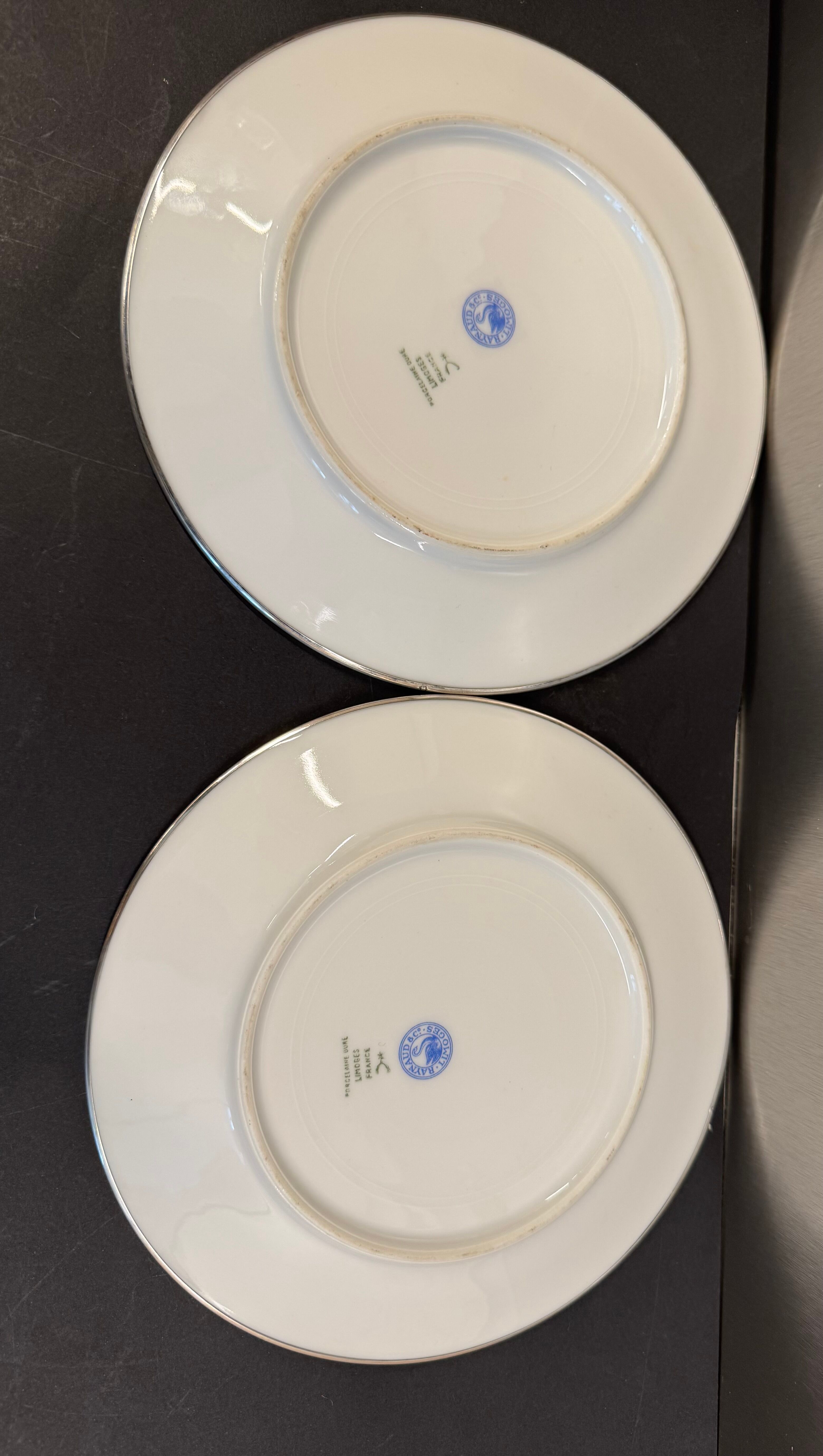 Two Raynaud Limoges plates and Tetard brothers silver.