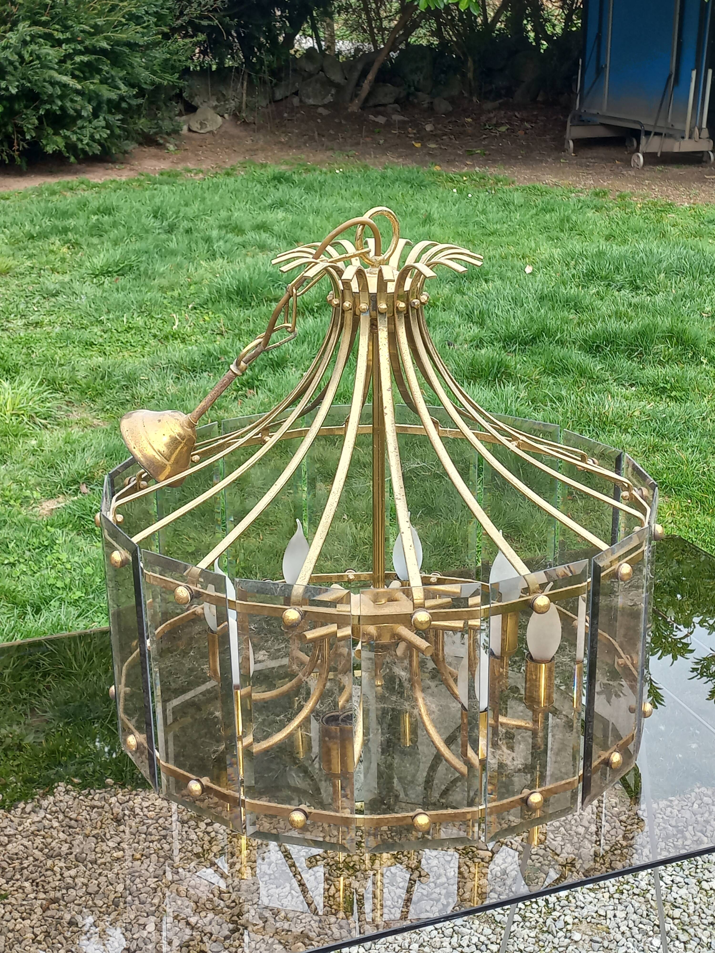 70s designer chandelier with smoked glass plates and gold metal frame