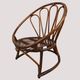 Fauteuil corbeille vintage en rotin à dossier soleil – Style Riviera, année