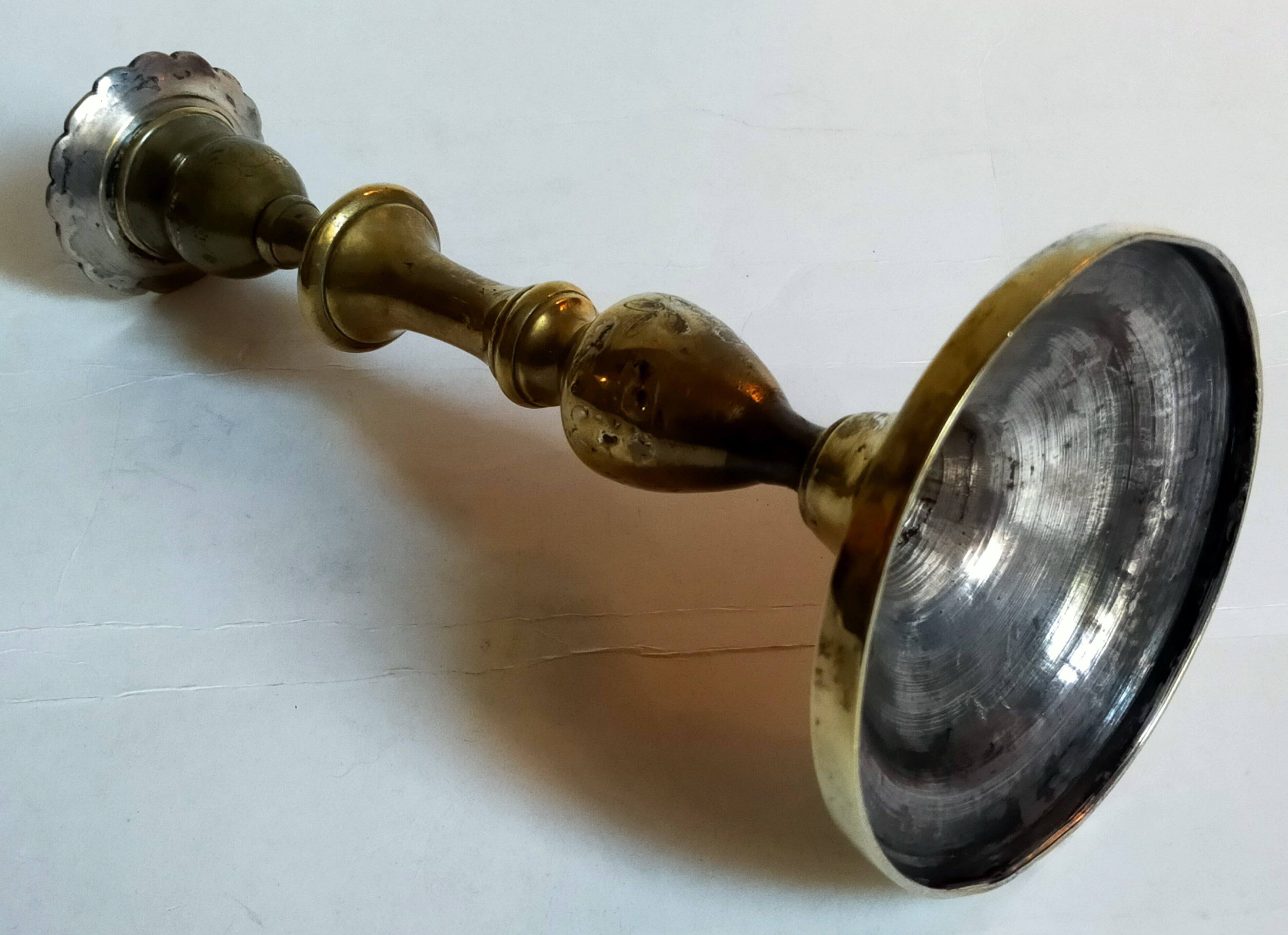 Duo of solid brass and gold metal candle holders worked old