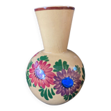 Terracotta vase decorated with flowers