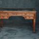Antique wooden desk with upholstered top and 5 drawers