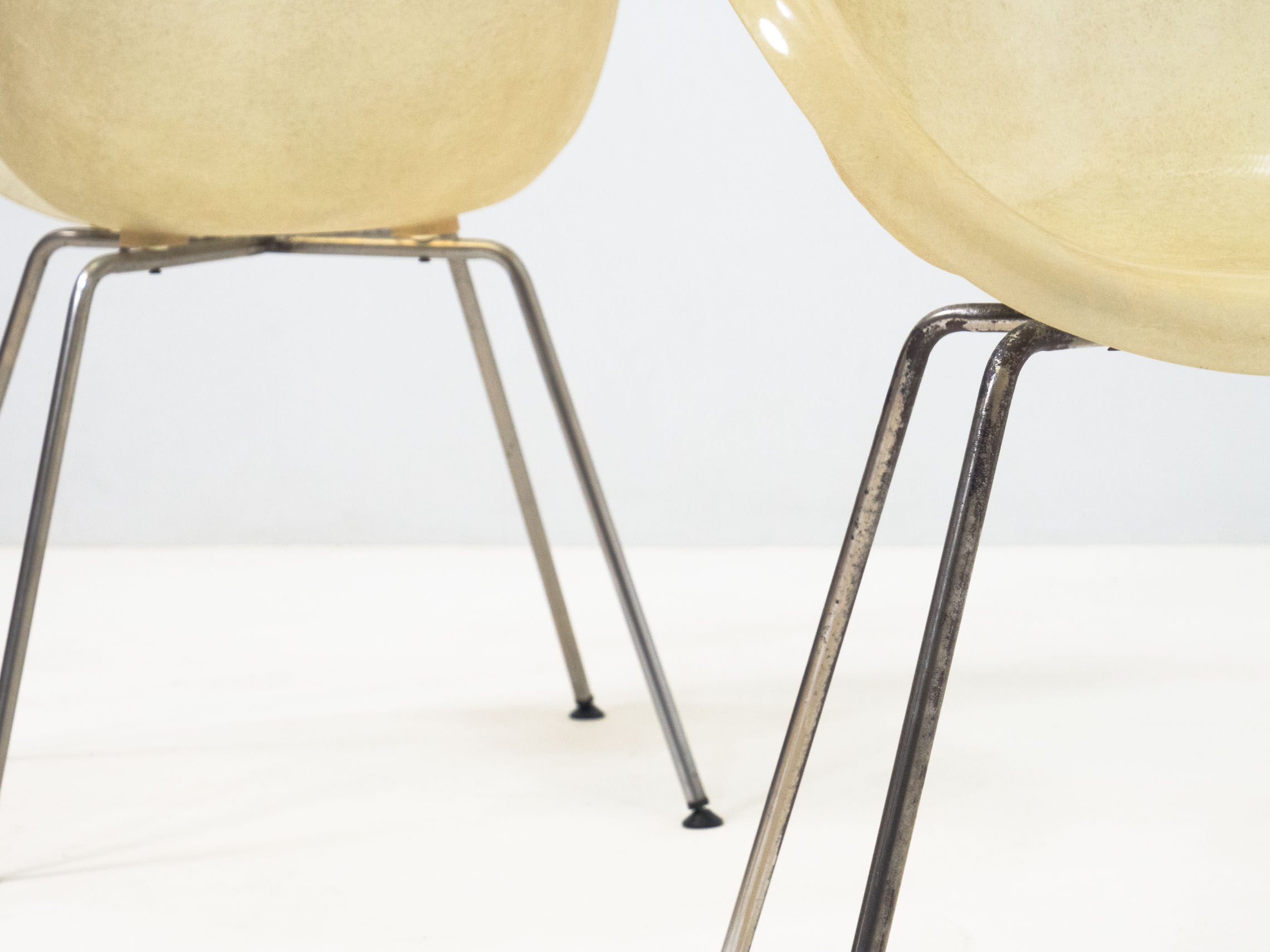 Set of two vintage fiber glass shell chairs