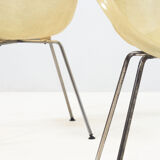 Set of two vintage fiber glass shell chairs