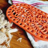 Orange enamelled cast iron oval trivet