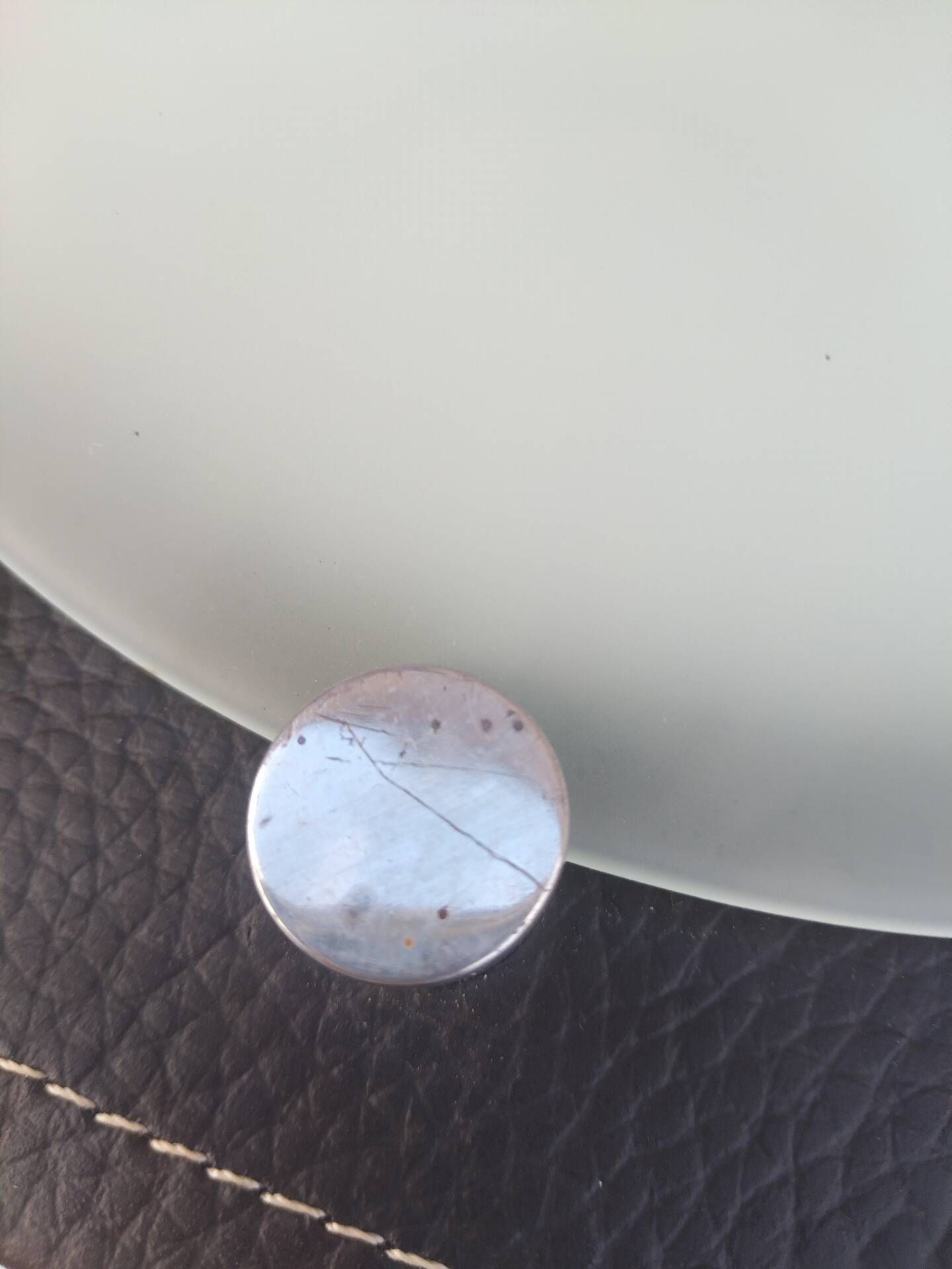 Wall light or ceiling light in frosted glass and leather-like material.