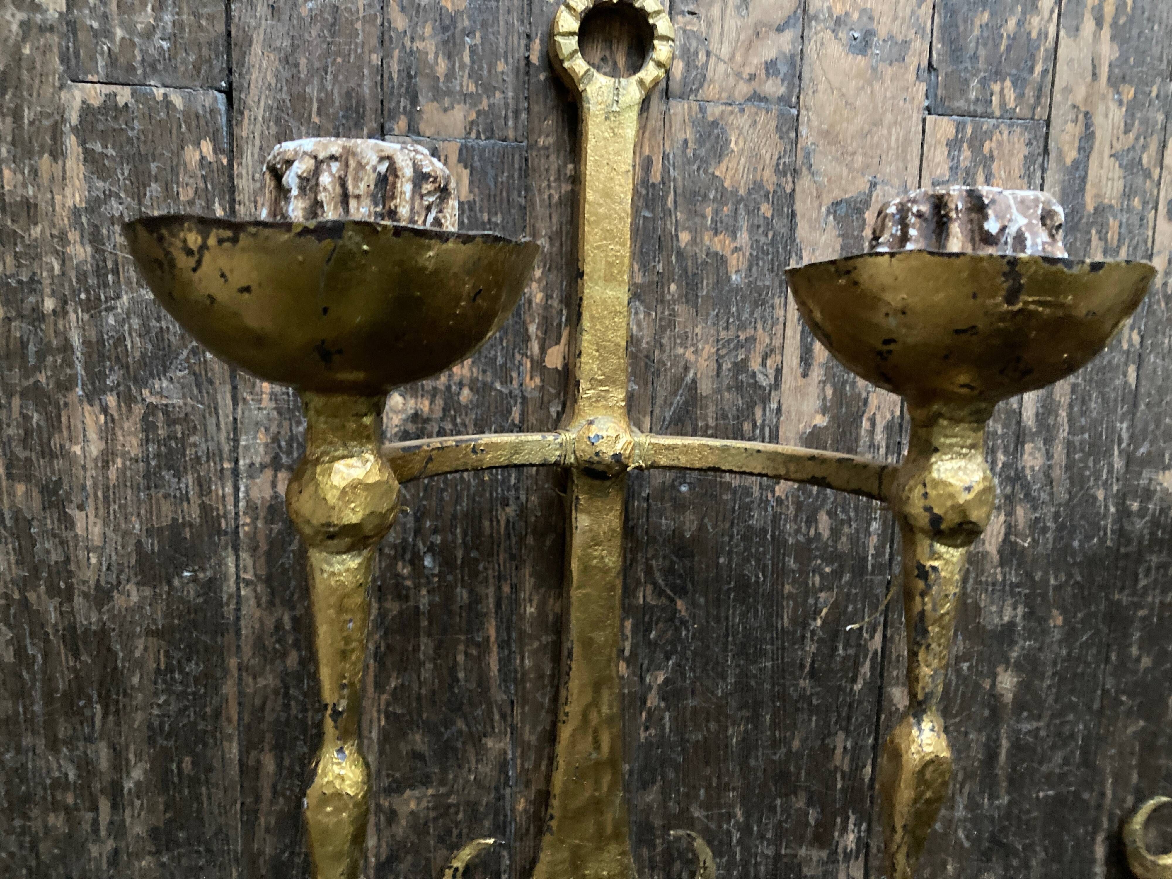 Pair of XXL torchlight sconces in golden beaten iron Italian work 1960