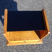 Vintage oak bedside table with tapered legs.