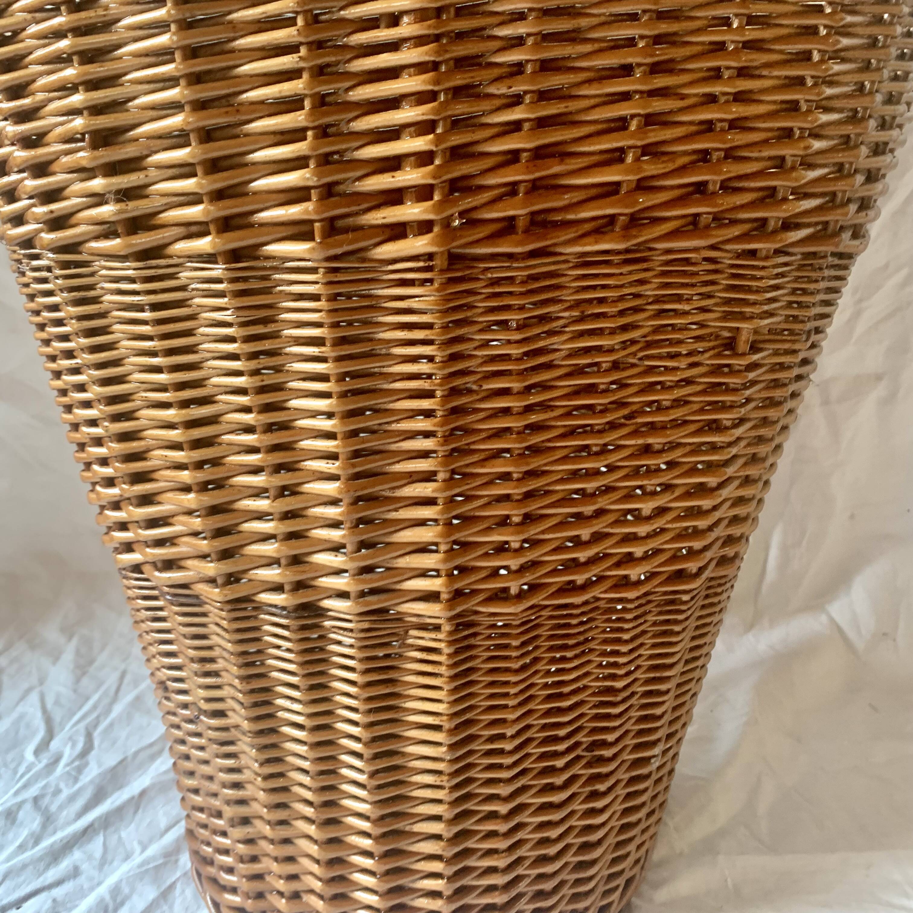 Old woven wicker umbrella stand