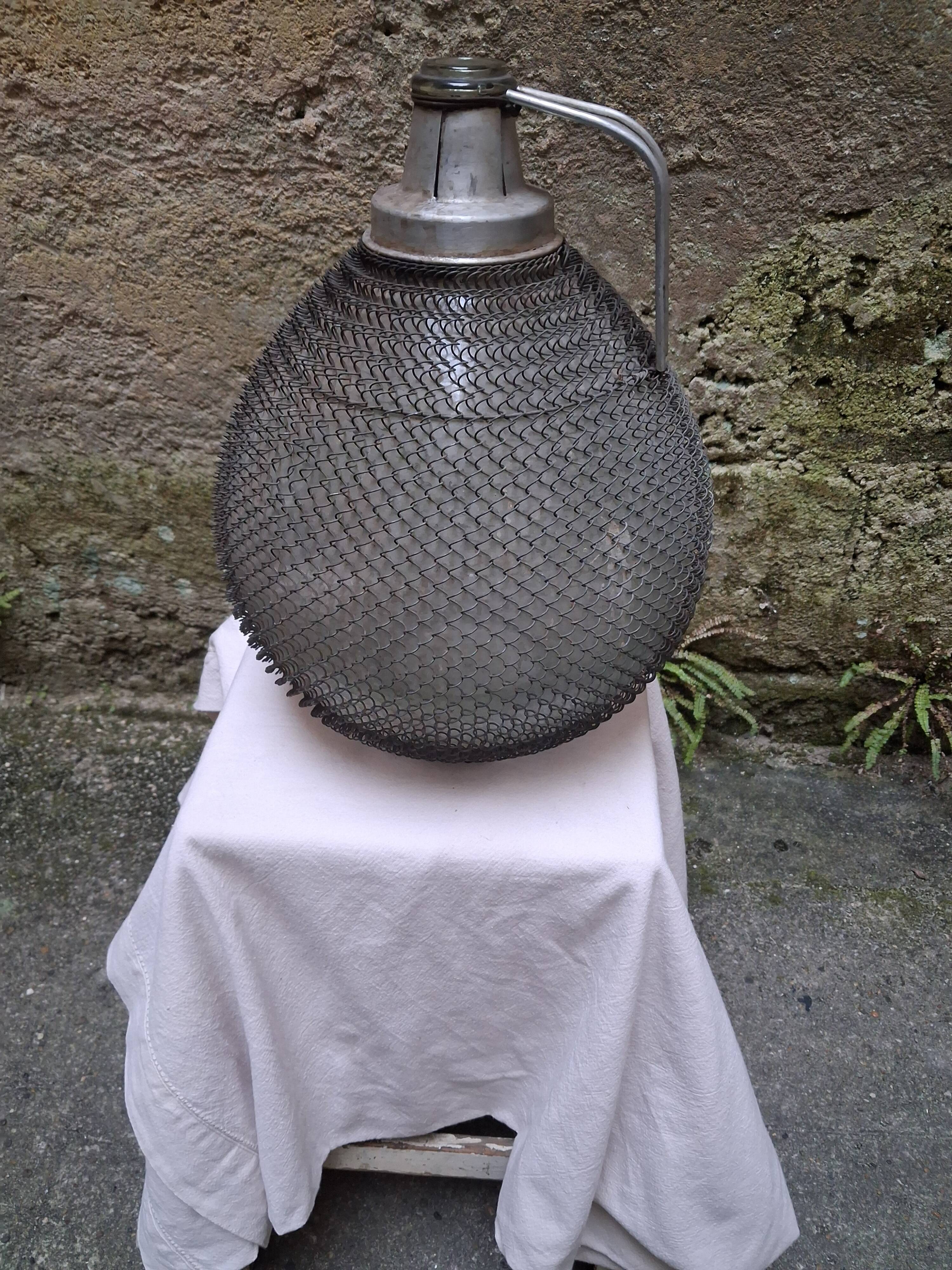 Demijohn, glass demijohn, with protective metal mesh, 1950-1960
