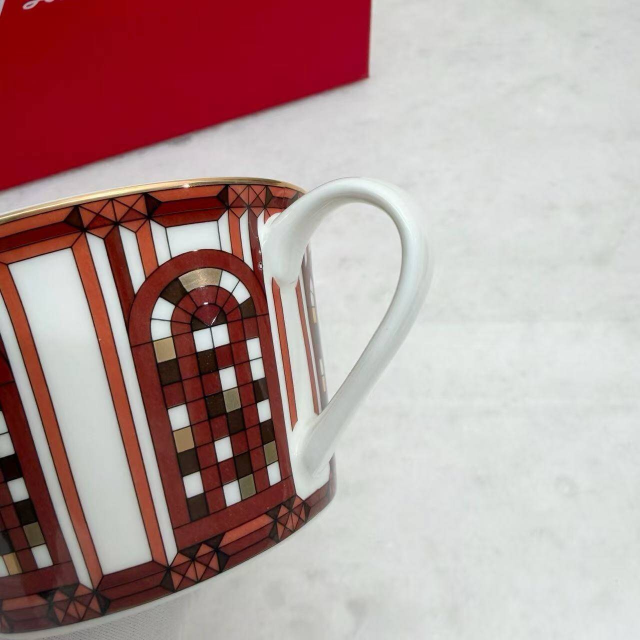 Pair of Baccarat Porcelain Coffee Cups and Saucers, Red Geometric Design