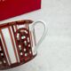 Pair of Baccarat Porcelain Coffee Cups and Saucers, Red Geometric Design
