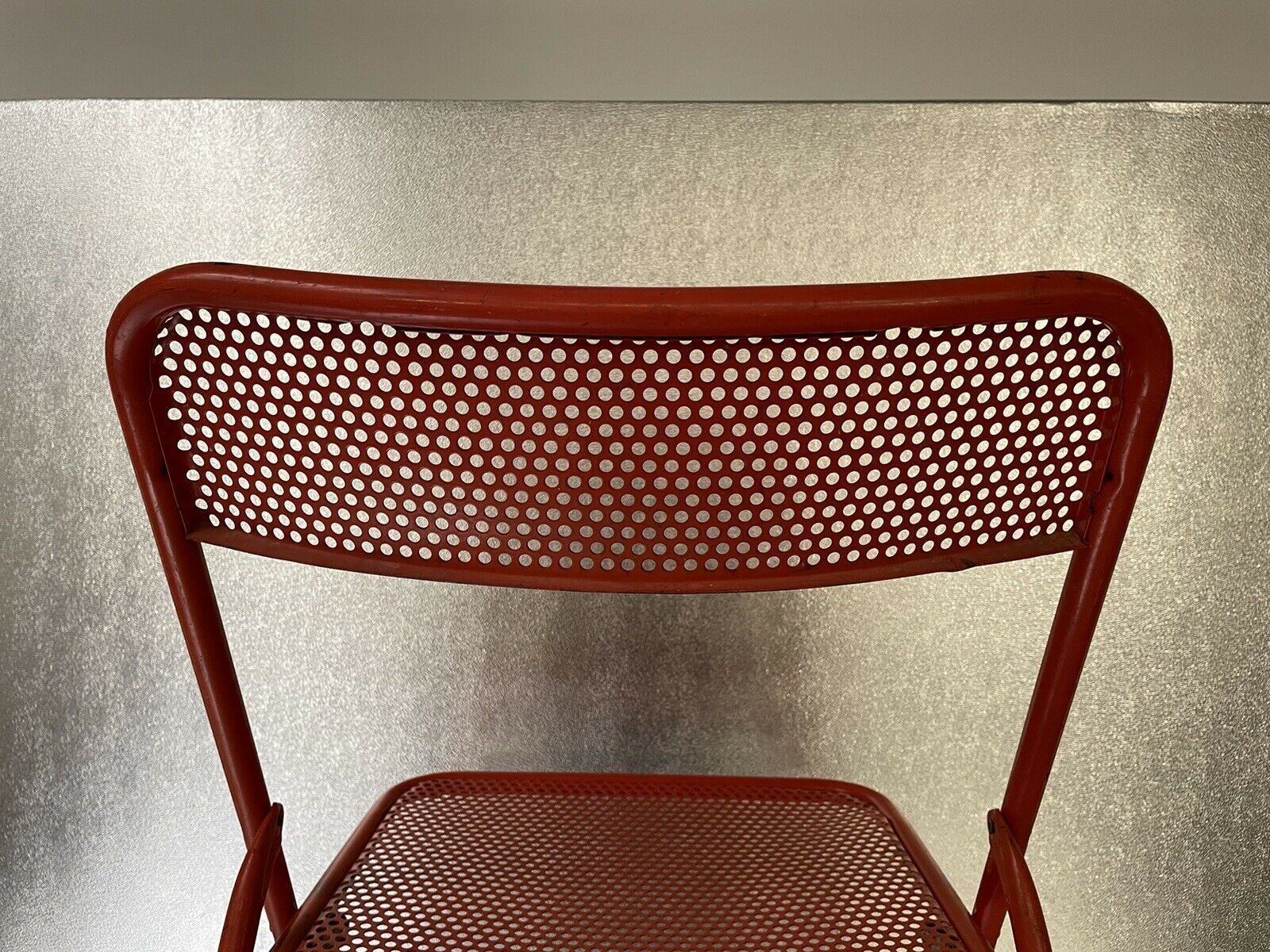 Old folding chair metal perforated red 60s, 70s, vintage