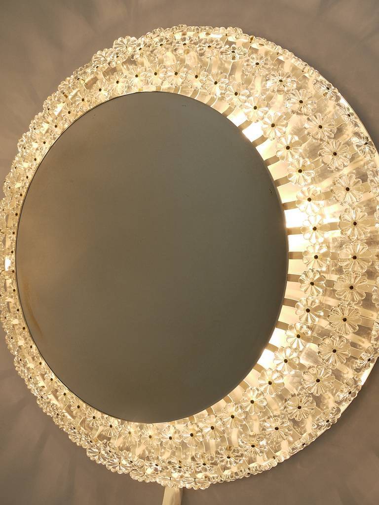 Large round wall mirror with glass flowers by Emil Stejnar, backlit by Nikoll, Austria.