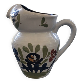 White pitcher with floral decoration