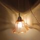 Amber tulip glass portable lamp, golden braided cord.