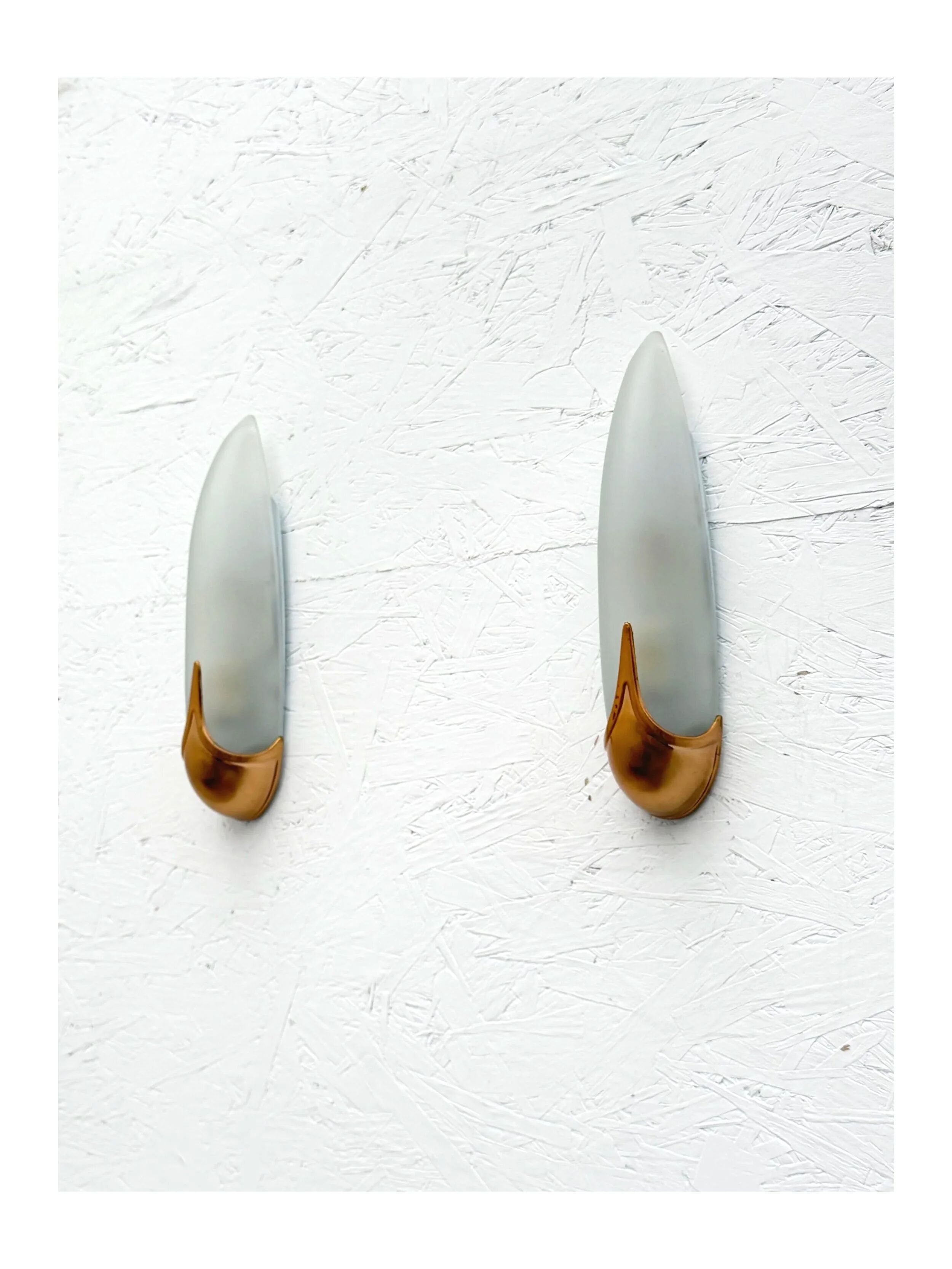 Pair of brass and opaline wall lights, Italy 1980.