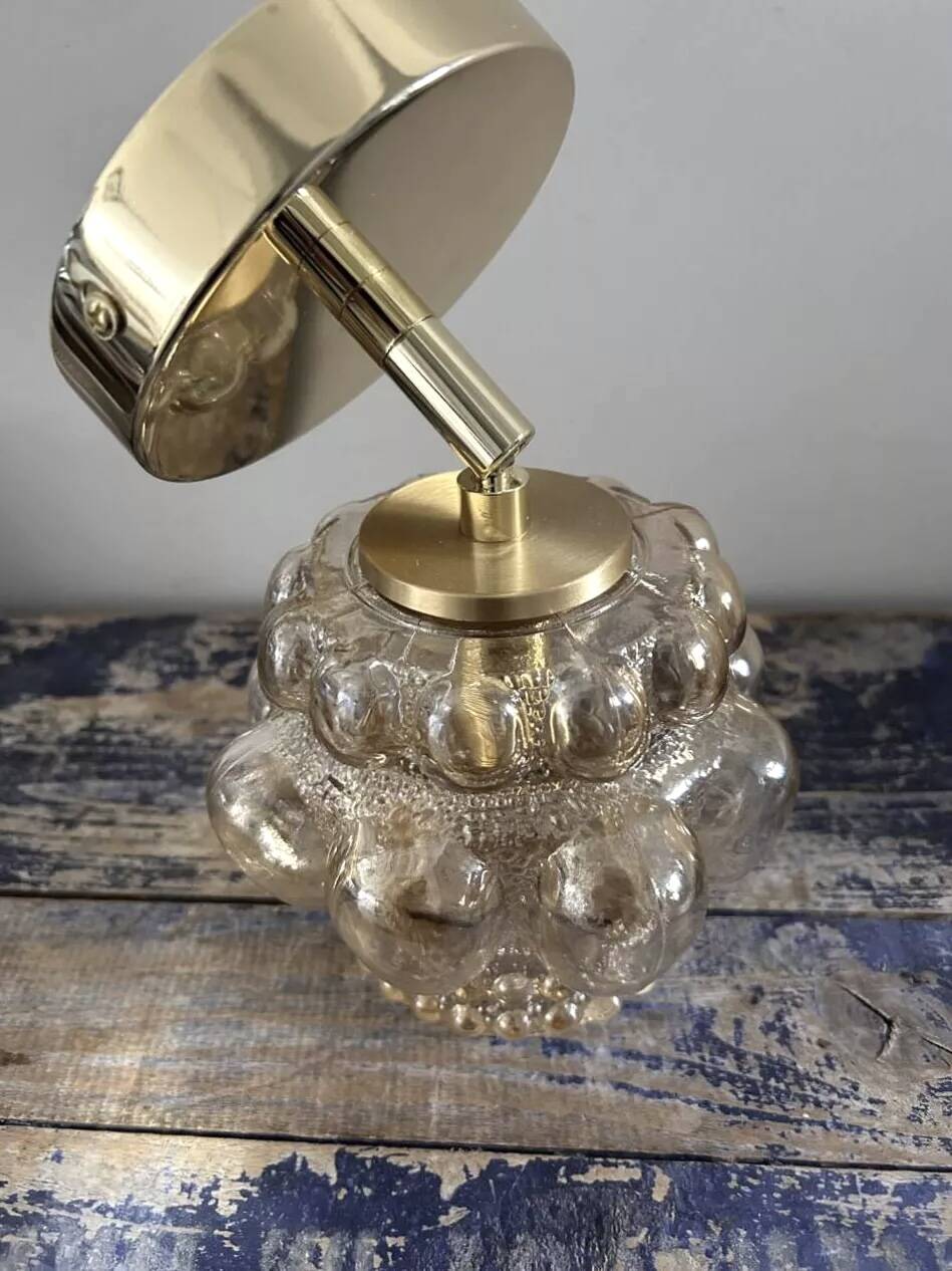 Gold tilting wall light