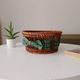 Vintage wicker and rattan basket with tartan fabric.