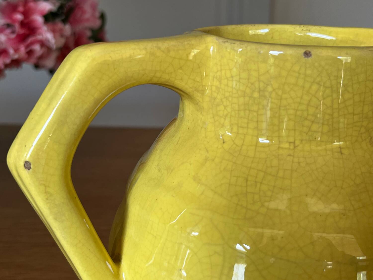 Old yellow ceramic pitcher