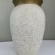 Cream speckled glazed vase with a gold rim, 1970s.