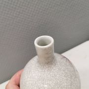 A vase in crackled porcelain with pink decoration. Germany 1930s