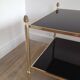 Neoclassical style coffee table in bronze and brass with double black lacquered glass tops from Maison Baguès