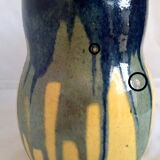 Yellow, blue and green rustic pitcher