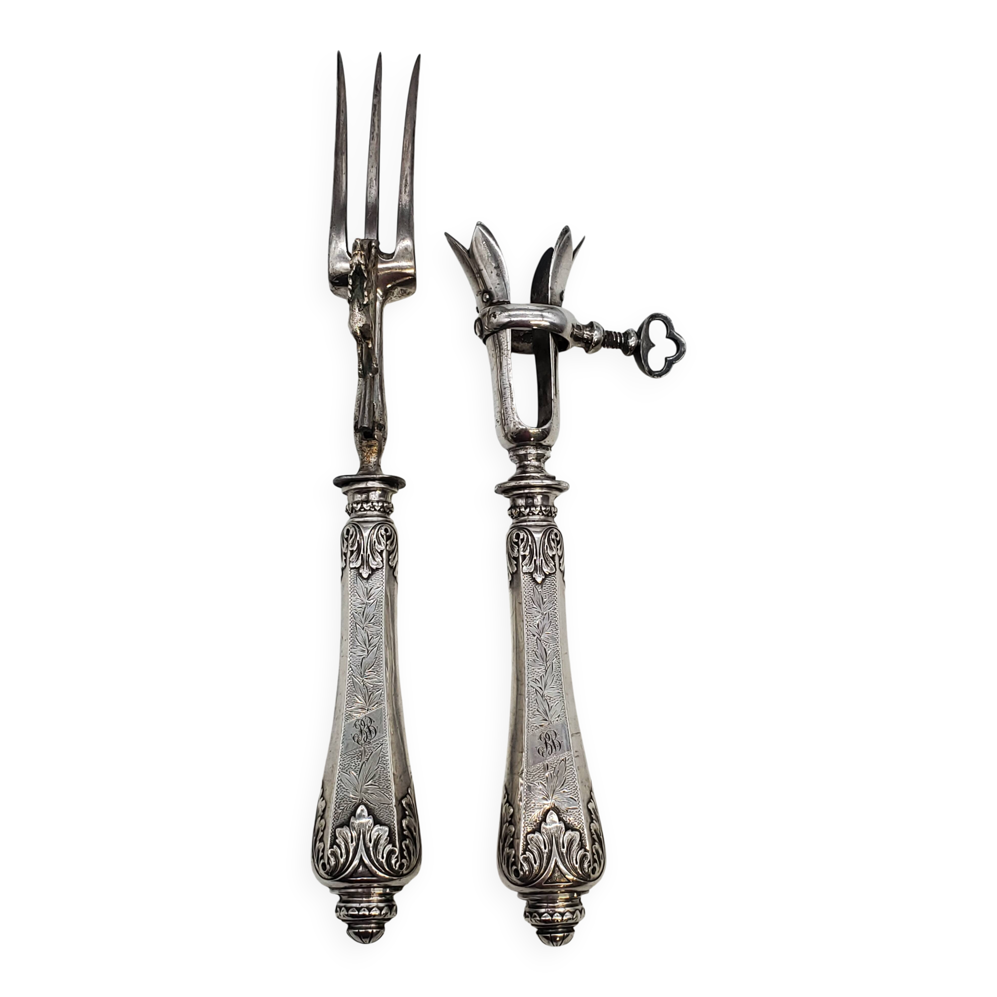 Set of serving forks and silver-plated leg of lamb fork.