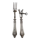 Set of serving forks and silver-plated leg of lamb fork.
