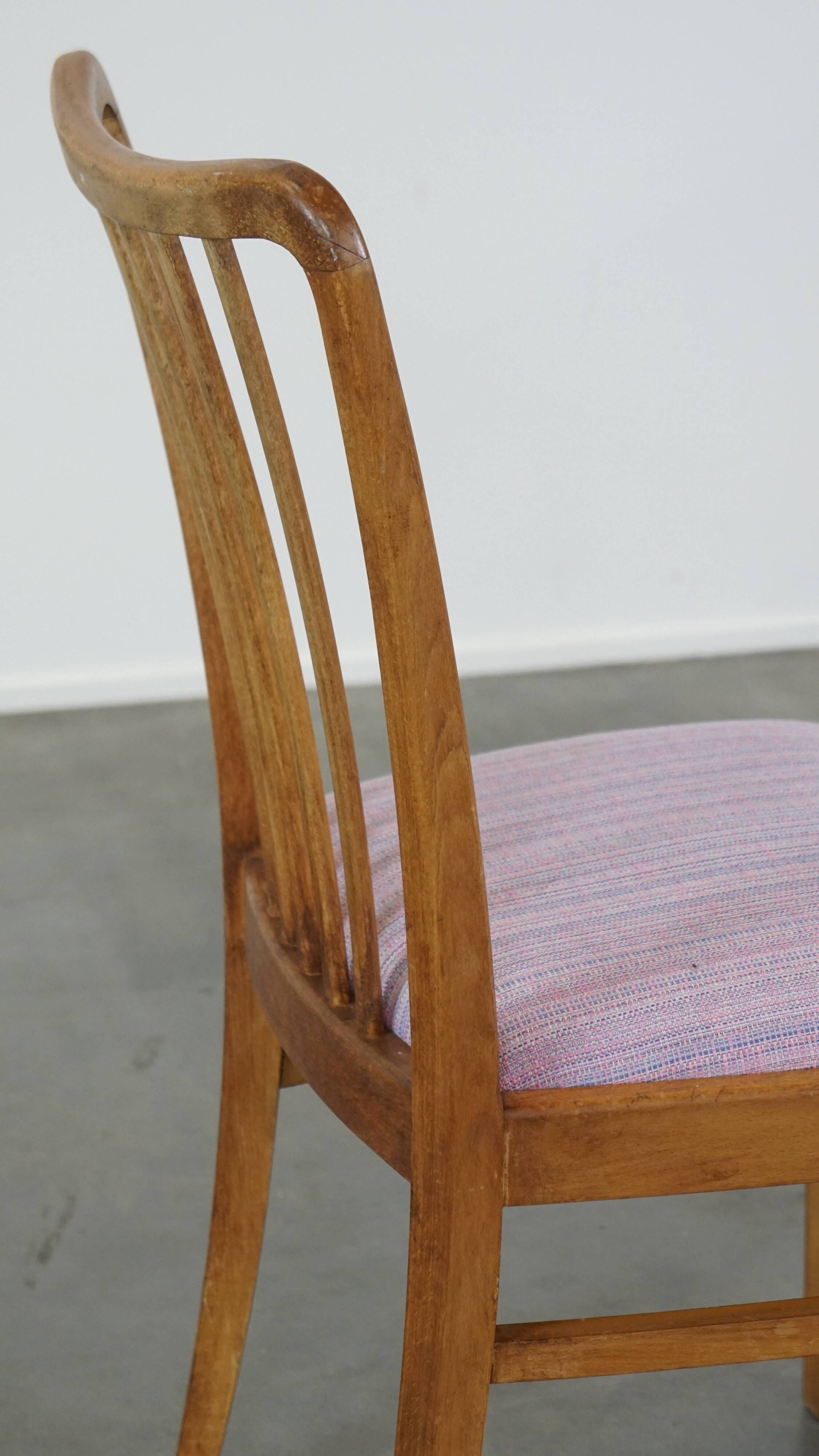 Set of 2 vintage dining chairs from the 1970s with spindle backrest and fabric seat