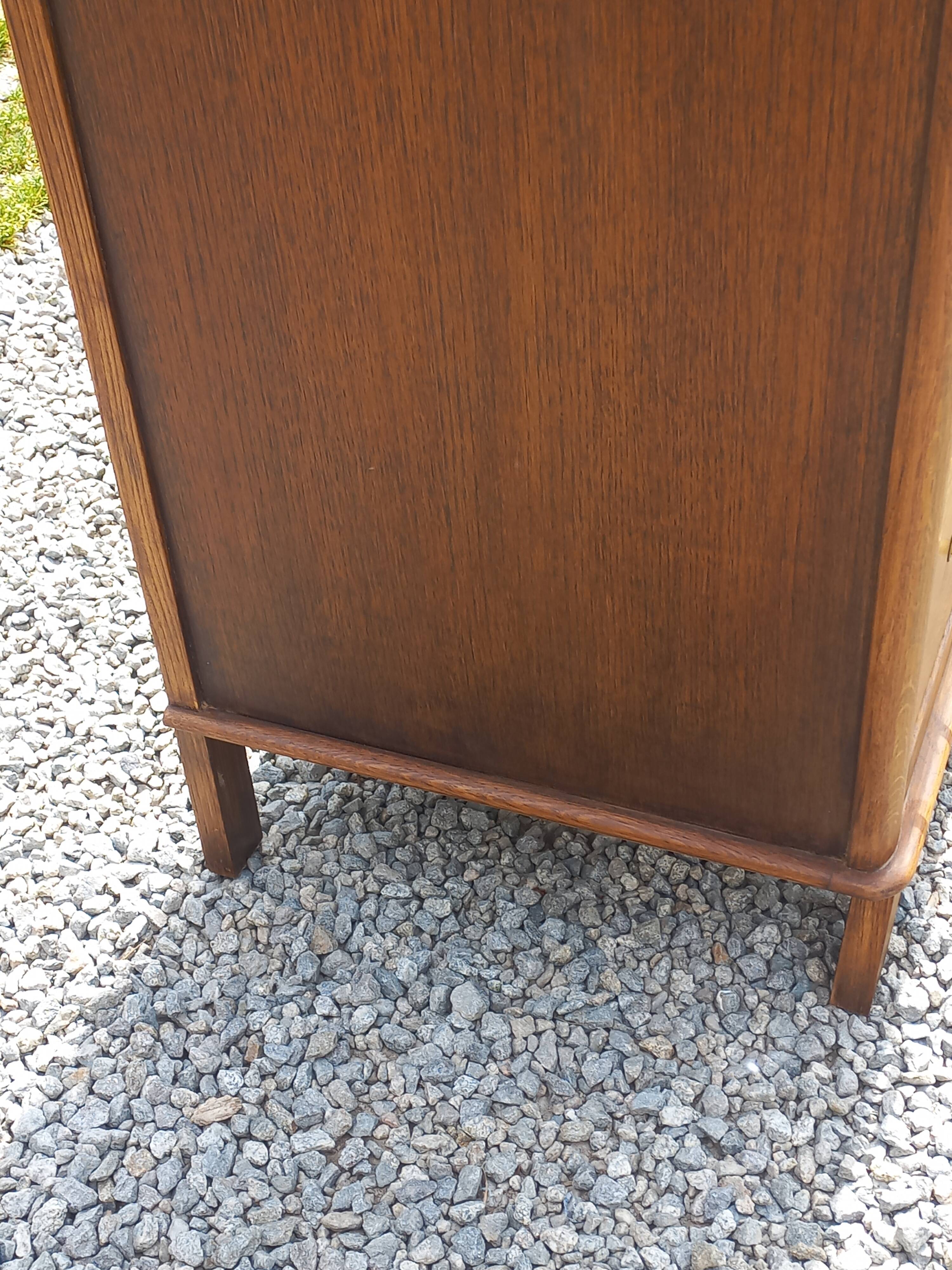 Vintage oak commode with tapered legs from the 1950s.