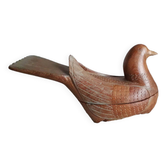 Curiosity object representing an ancient bird in carved wood
