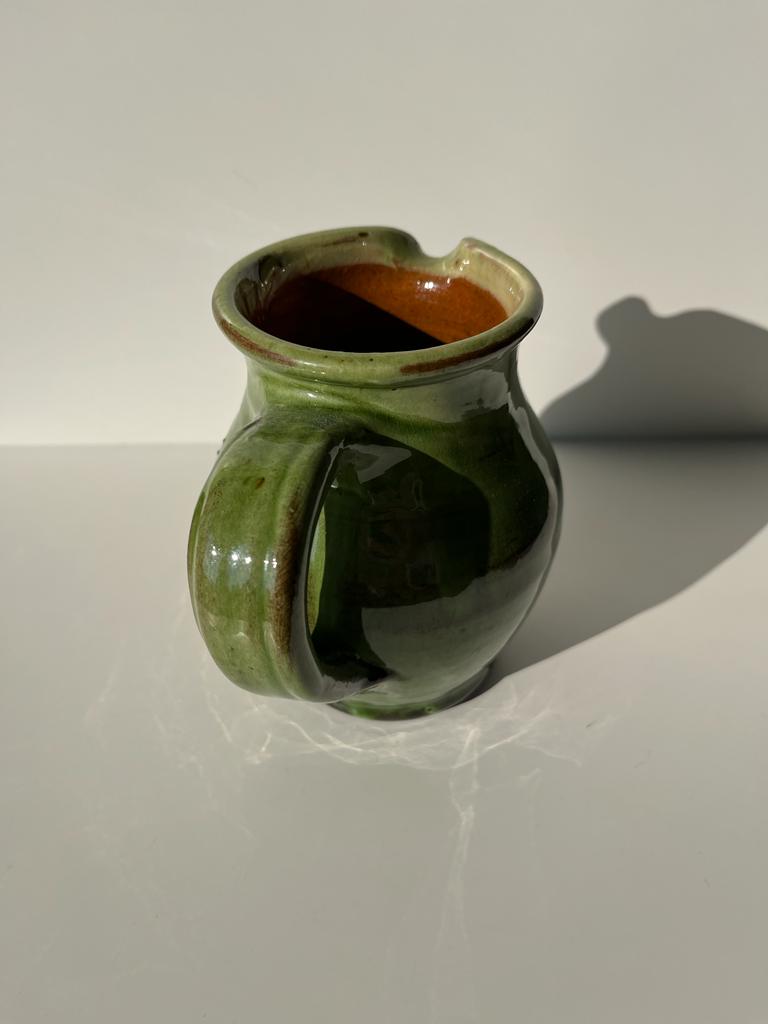 Green glazed ceramic pitcher