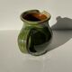 Green glazed ceramic pitcher