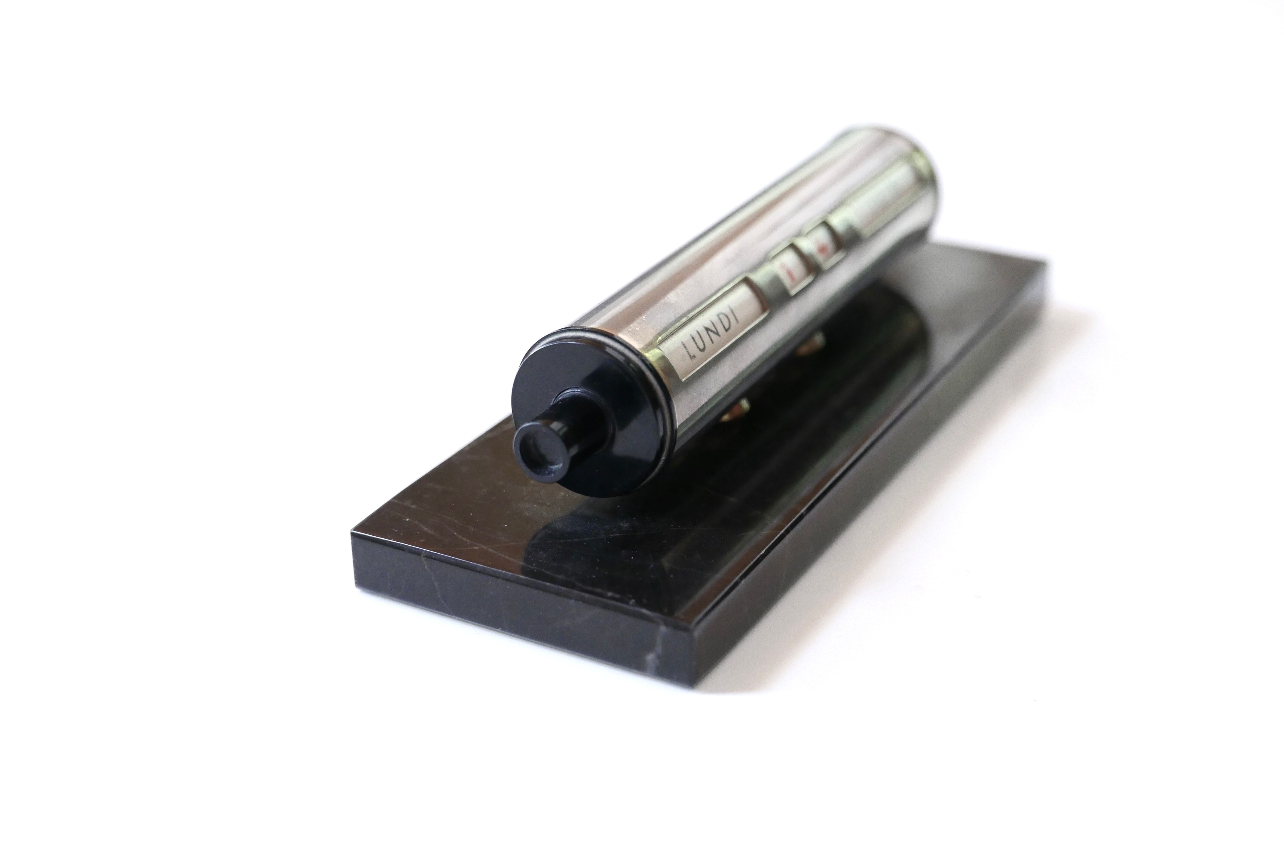 Tubular perpetual calendar, black marble base, 50s